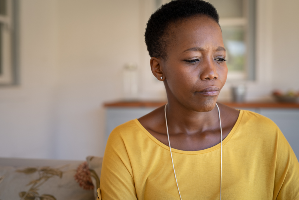 Woman considering her fibroid treatment options after learning about uterine fibroids
